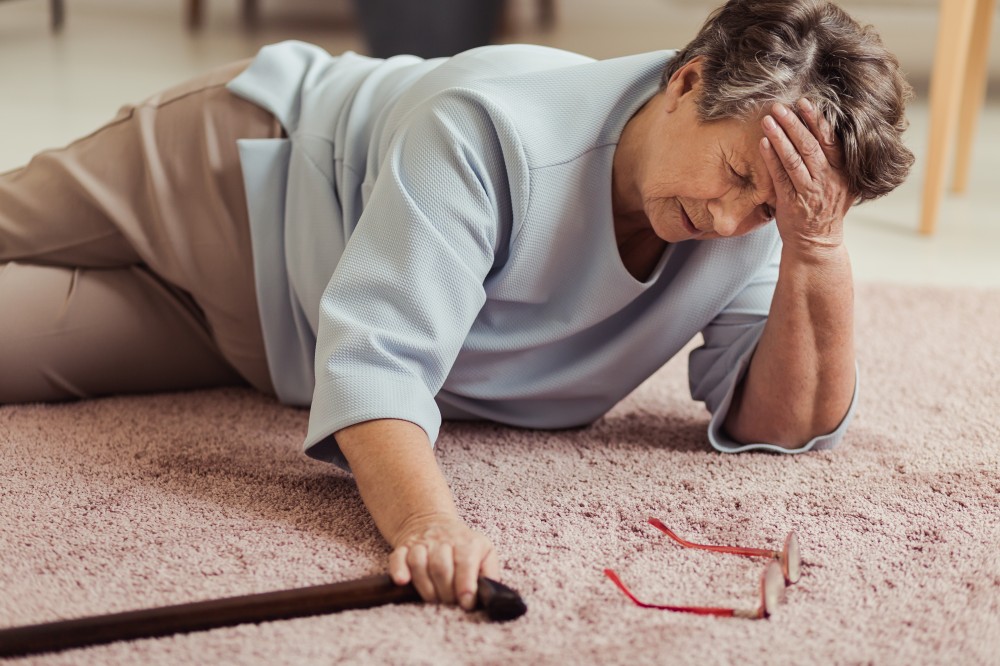 Elderly woman falling over